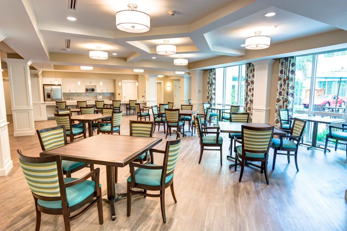 A spacious dining area with modern decor and ample seating.