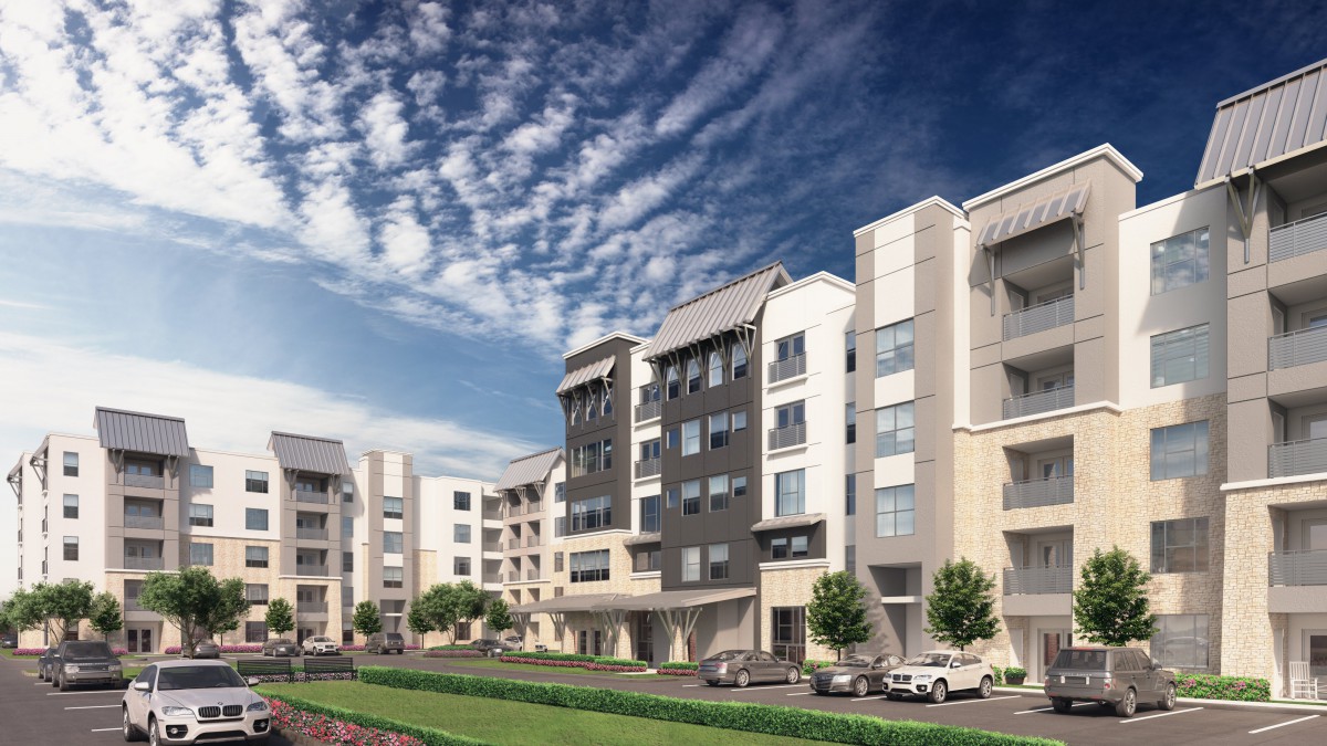 Modern apartment complex under a vibrant blue sky.
