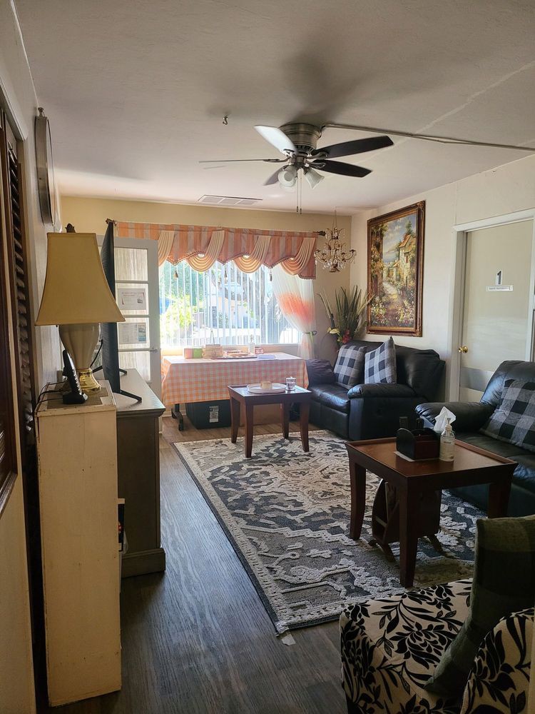 A cozy living room with comfortable seating and elegant decor.