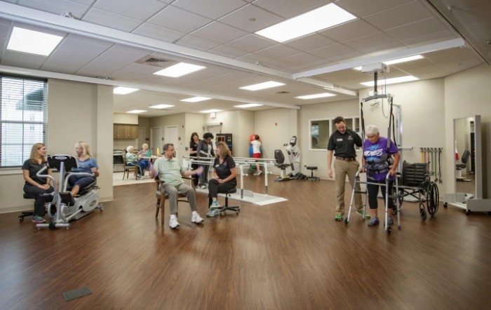 A group of people engaged in physical therapy at a rehabilitation center.