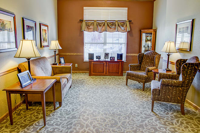 A cozy living room with elegant furnishings and warm lighting.