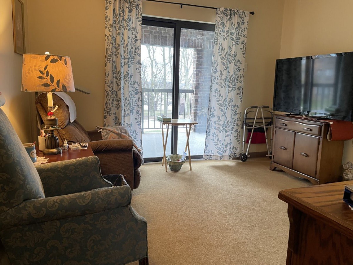 A cozy living room with comfortable seating and a TV.