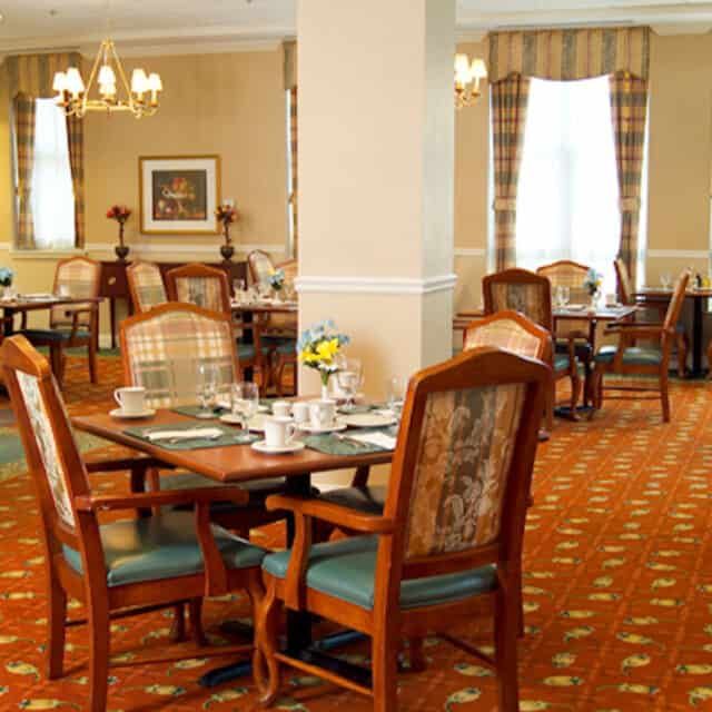 A cozy dining area with elegant furnishings and decor.