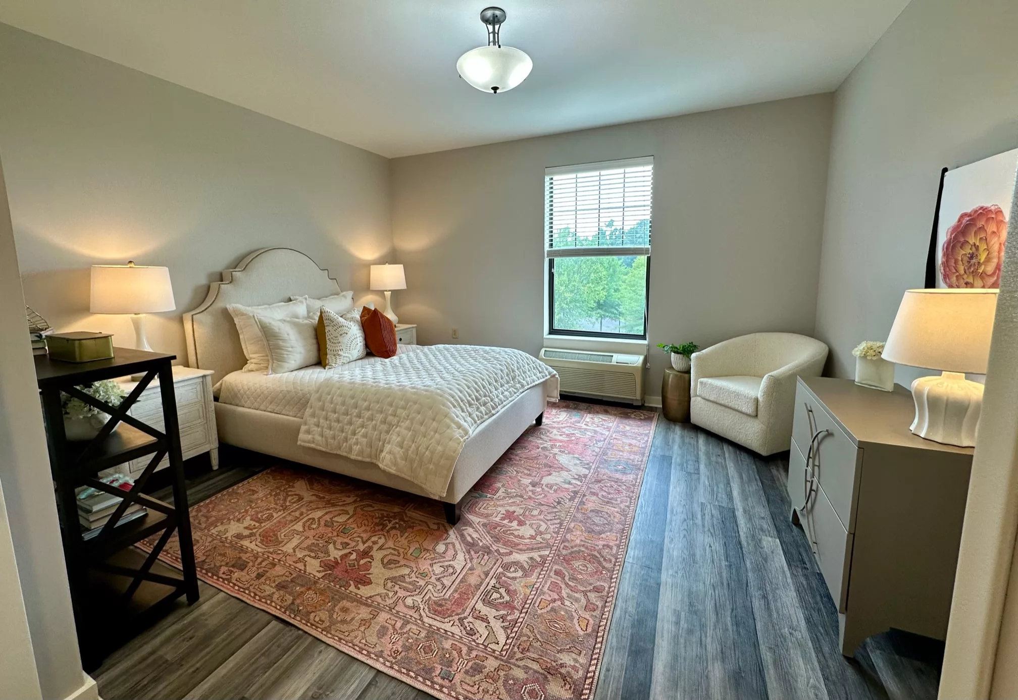 A modern bedroom with stylish decor, featuring a comfortable bed and elegant furnishings.