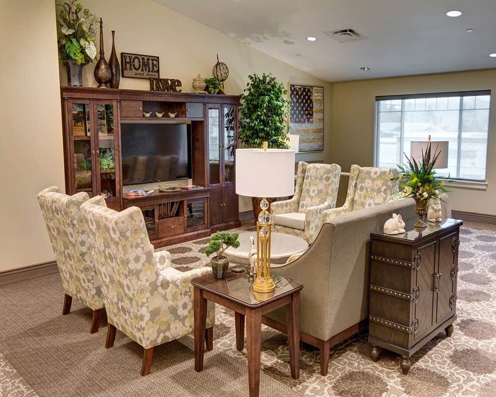 A cozy living room with comfortable seating, warm lighting, and stylish decor.