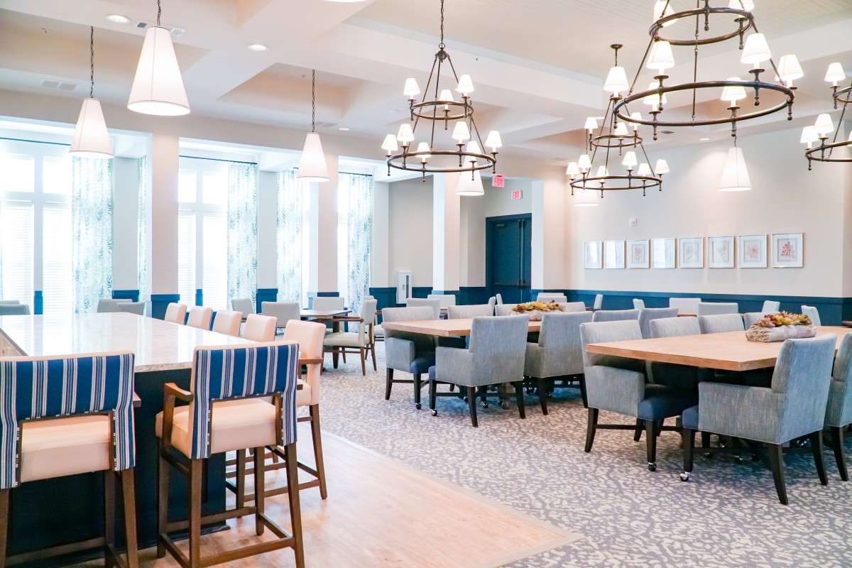 A modern dining area with stylish decor and ample seating.
