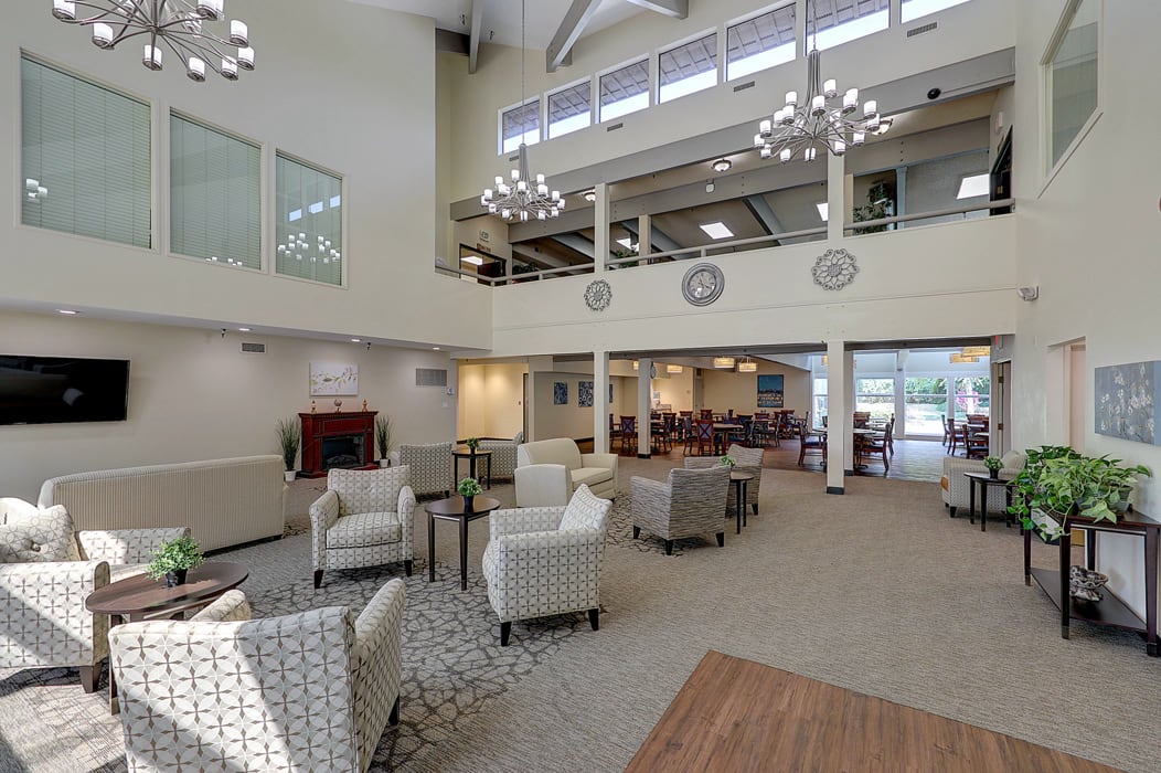 A spacious, modern lobby with comfortable seating and stylish lighting.