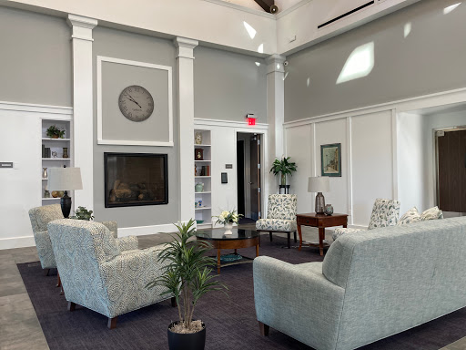 A spacious and modern lobby featuring comfortable seating, elegant decor, and a cozy atmosphere.