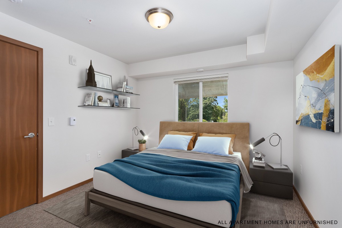 A modern, minimalist bedroom with a double bed and blue blanket, featuring nightstands and decorative shelves under soft indoor lighting.