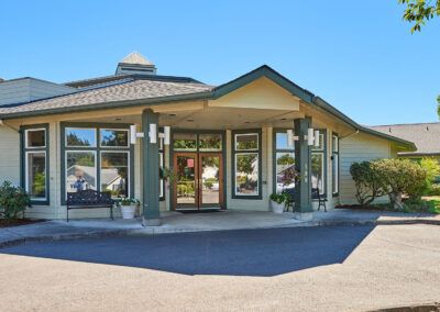 A scenic view of a building entrance under a clear blue sky.