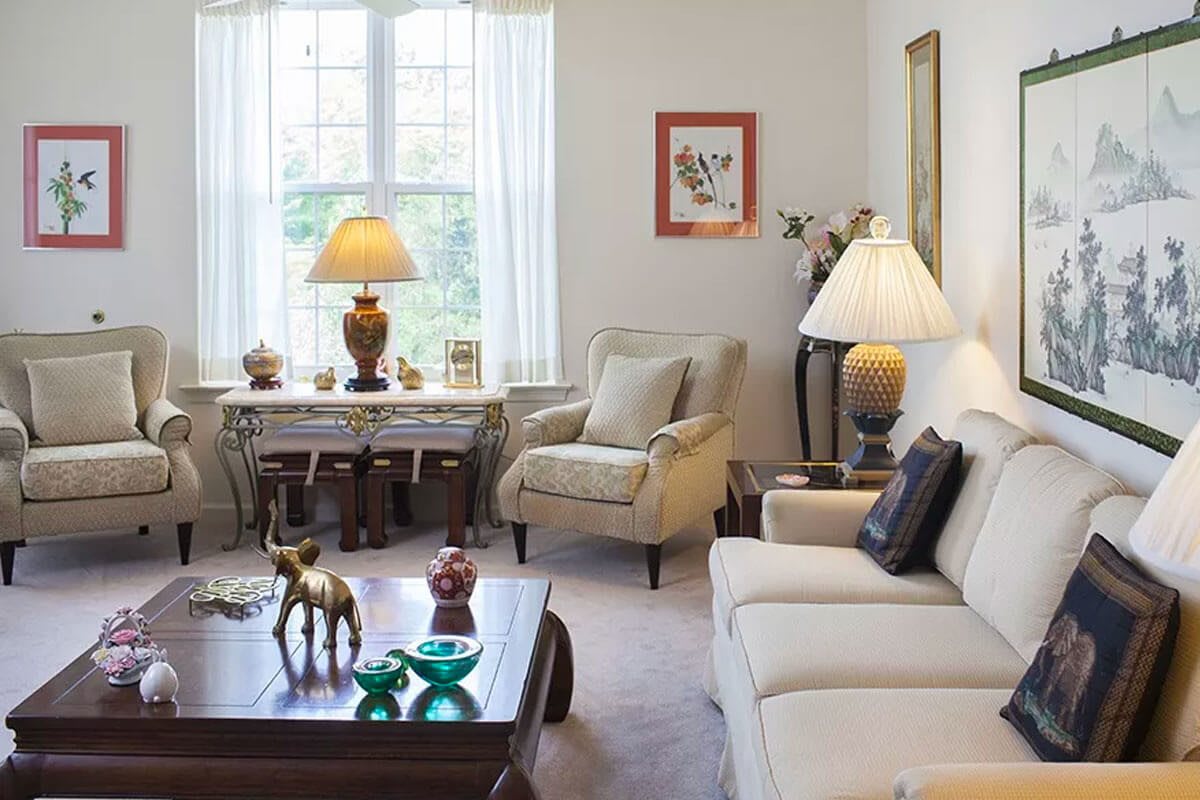 A cozy living room with comfortable seating and warm lighting.