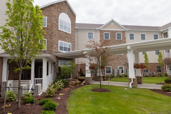 A well-maintained residential building with a landscaped garden.