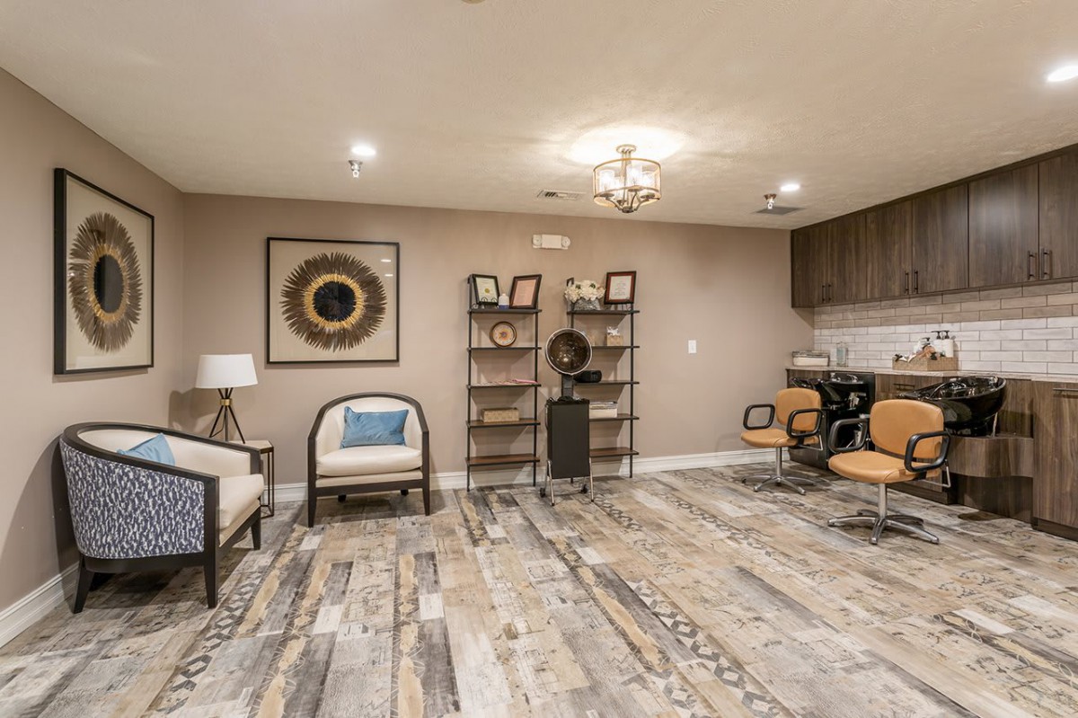A modern living room with stylish furniture and decorative elements.