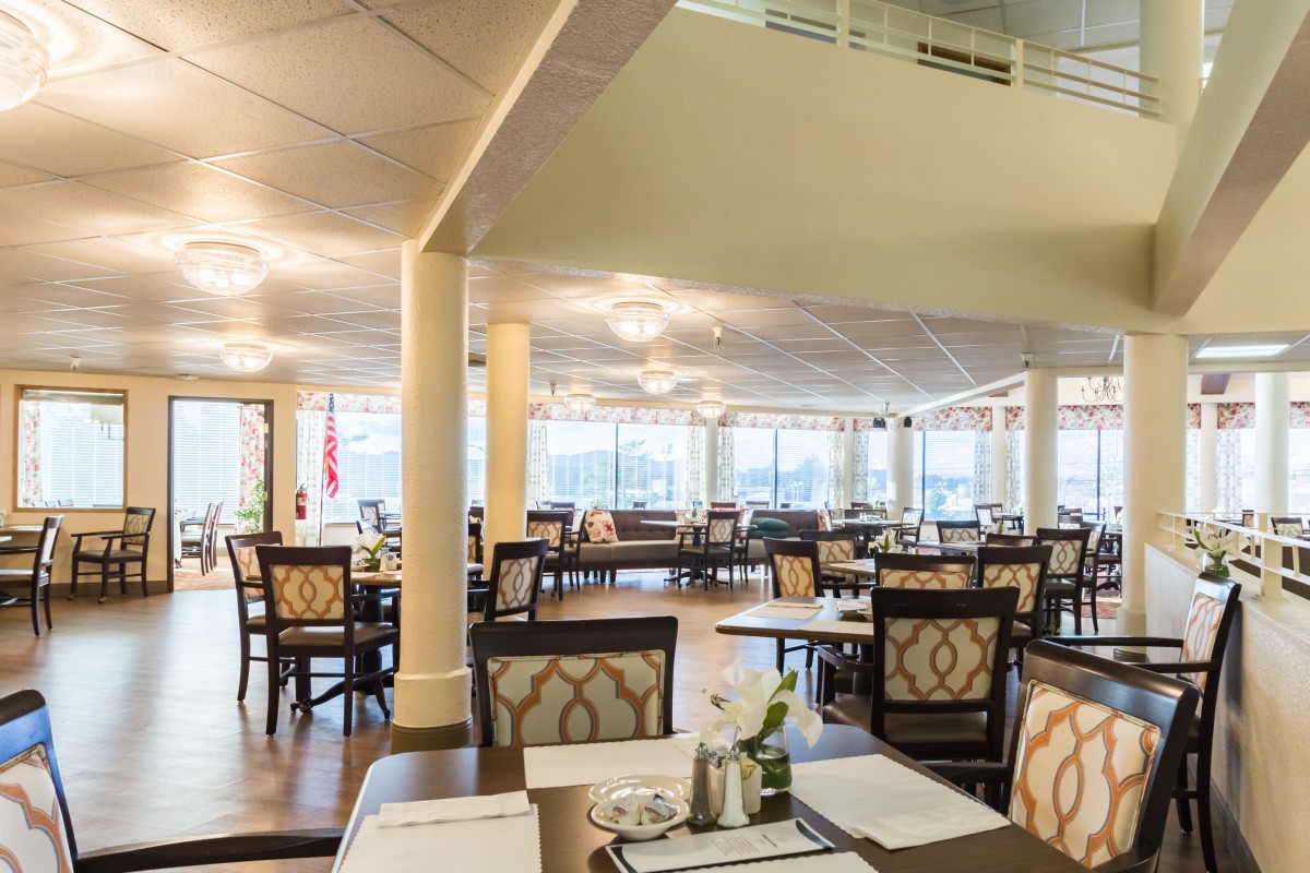 Spacious and elegantly designed restaurant dining area with large windows.