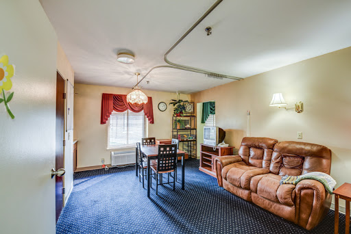 Cozy living room area featuring a comfortable couch and dining table.