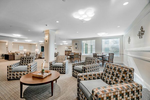 A modern living room with comfortable seating and ample natural light.