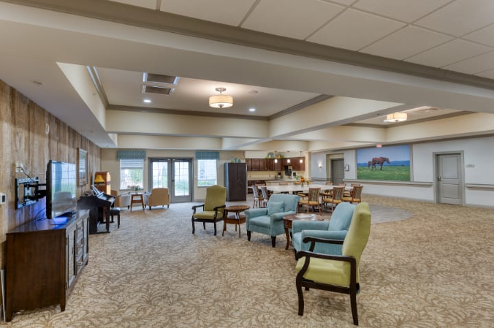 A spacious and cozy lounge area with comfortable seating and warm lighting.
