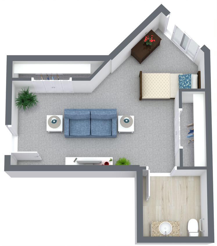A top-down view of a small apartment floor plan, featuring a living room with a sofa and coffee tables, and a separate bedroom area.