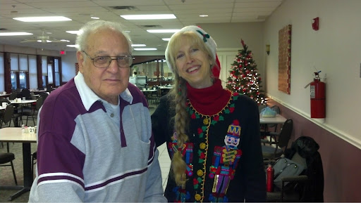 A joyful moment shared during a holiday celebration, featuring festive decorations and cheerful attire.