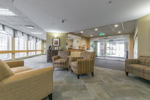 A modern lobby featuring comfortable chairs and a welcoming reception area.