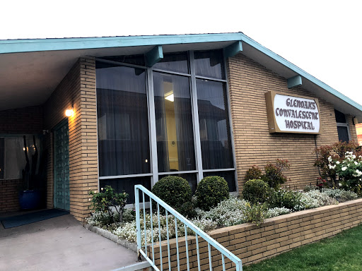 A community hospital with a welcoming entrance and well-maintained landscaping.