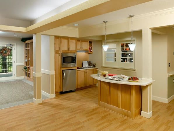 Modern kitchen with an open layout and wood flooring.