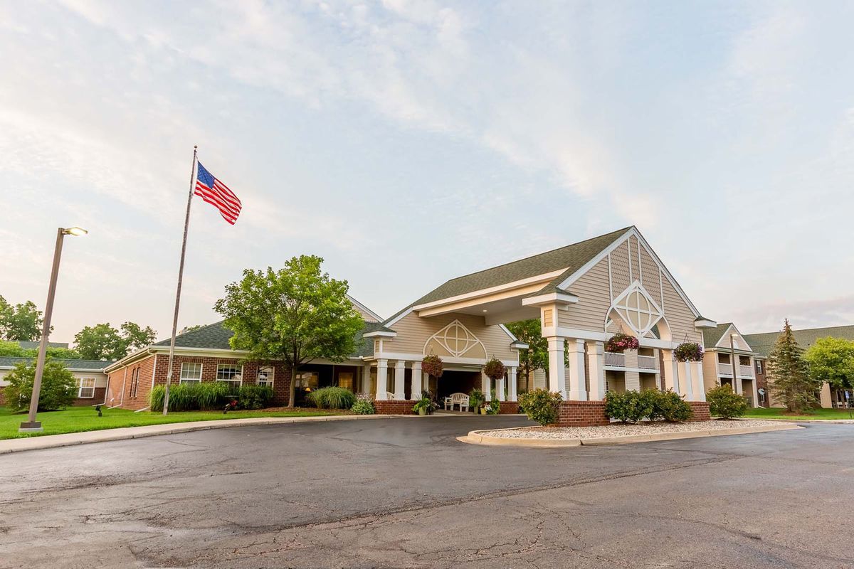 A building with an American flag outside on a clear day.