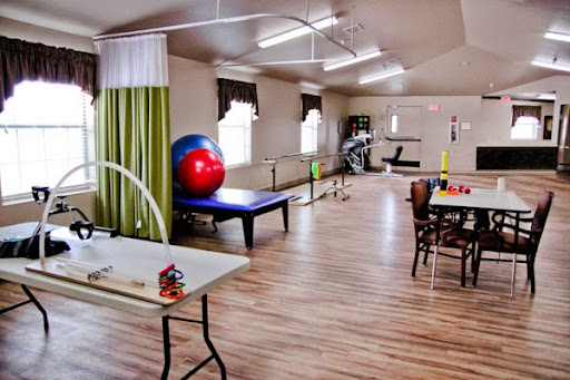 A spacious rehabilitation center equipped with exercise tools and a bright, welcoming atmosphere.