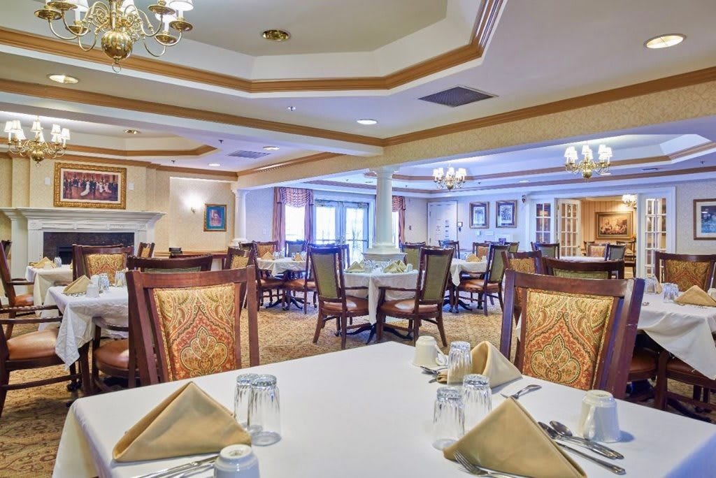 Elegant dining room with neatly arranged tables and classic decor.