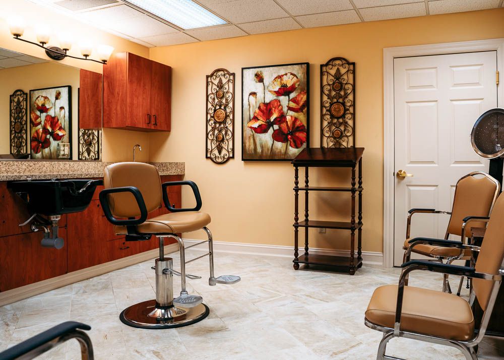 A well-appointed hair salon with stylish chairs and elegant decor.