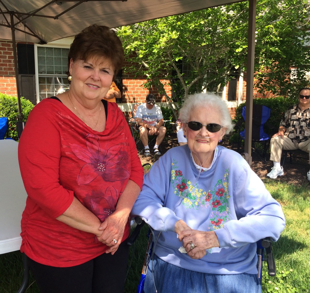 Two women enjoying a sunny day in the garden.