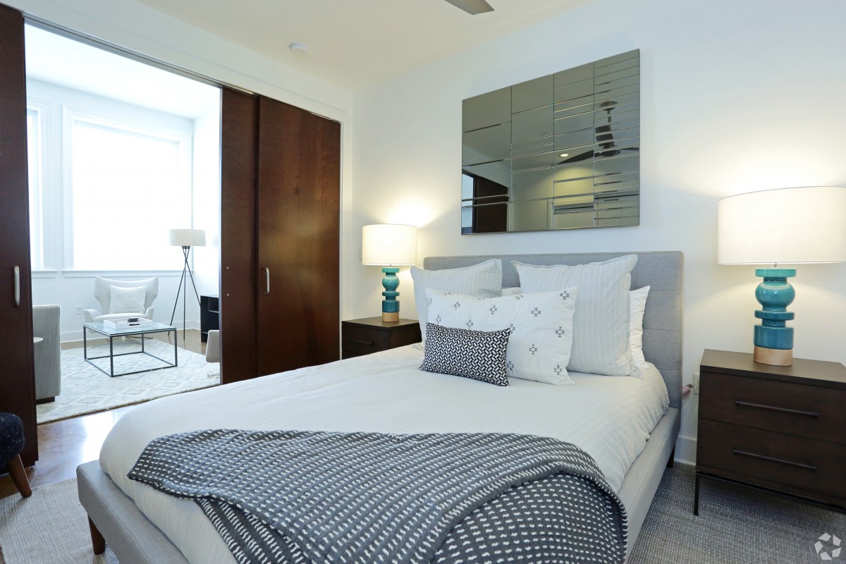 A modern and minimalist bedroom with stylish decor.