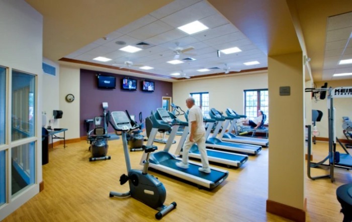A fitness center with treadmills and exercise equipment.