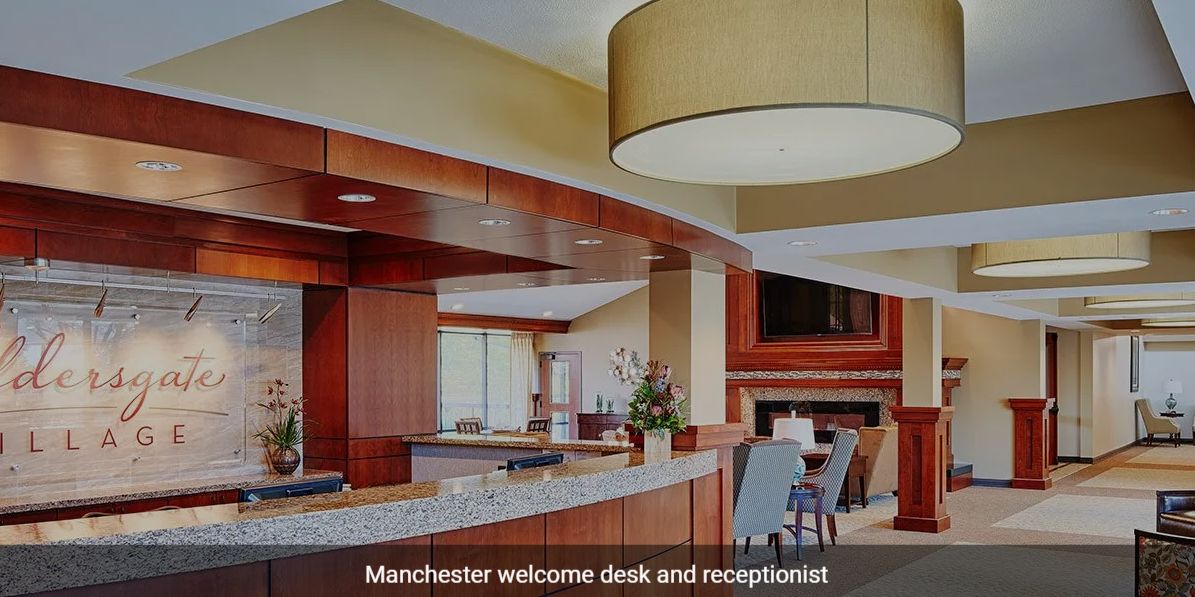 A modern reception area with a welcome desk and seating.