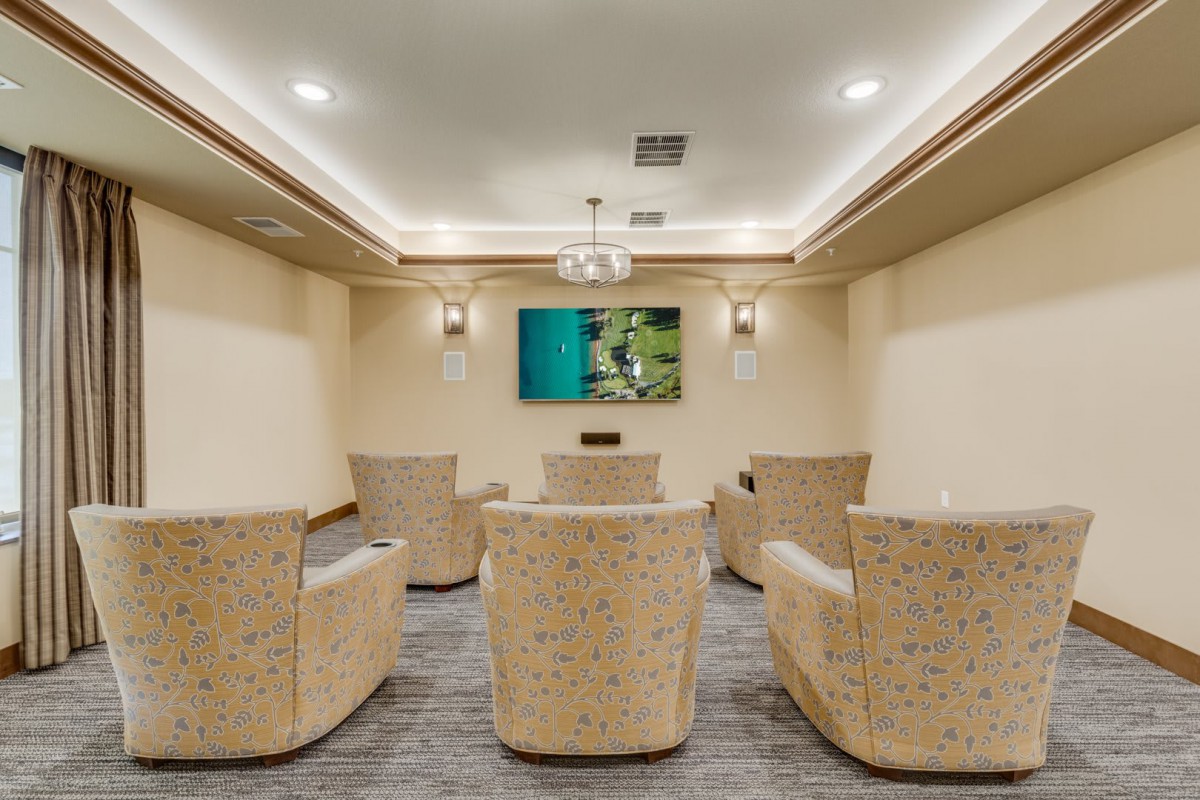 A cozy home theater with plush seating and ambient lighting.