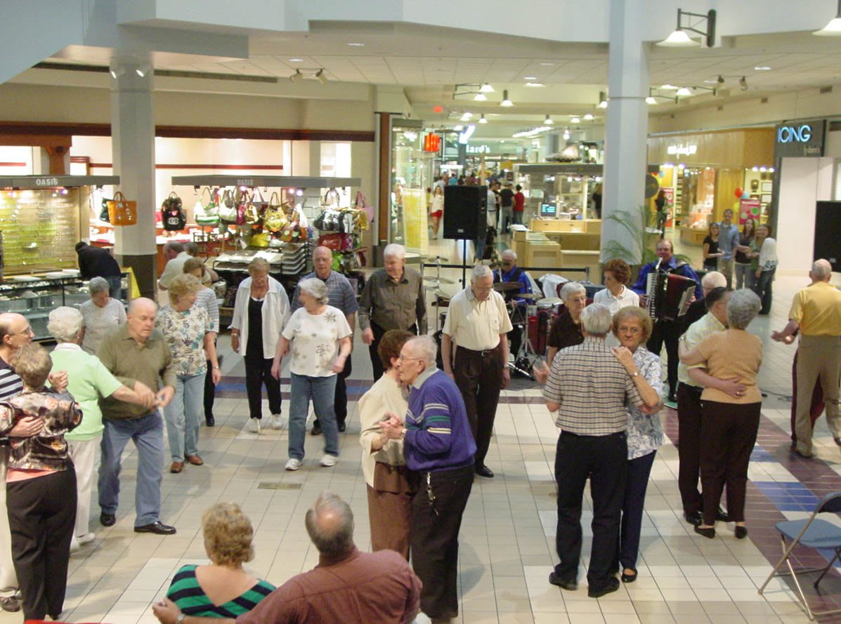 A group of people gathered inside a mall for an event.