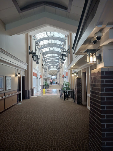 A spacious and well-lit commercial hallway featuring modern architectural design.