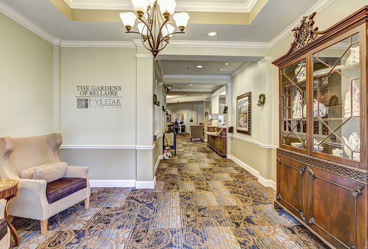 Luxurious hallway with elegant decor and lighting.