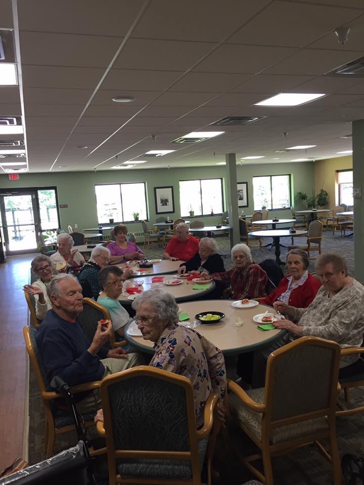 A group of seniors socializing at a community center.
