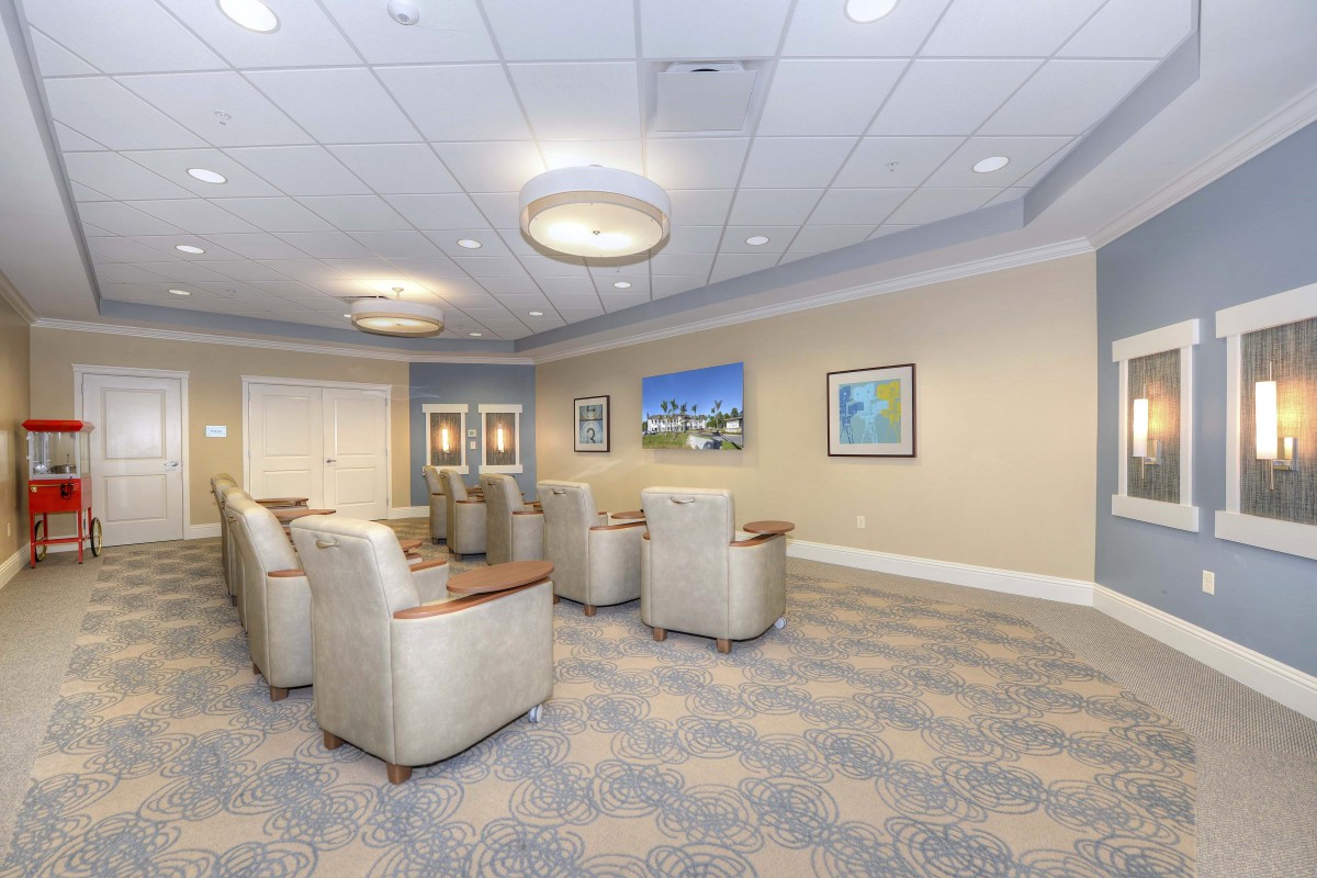 A modern conference room with comfortable seating and decorative artwork on the walls.