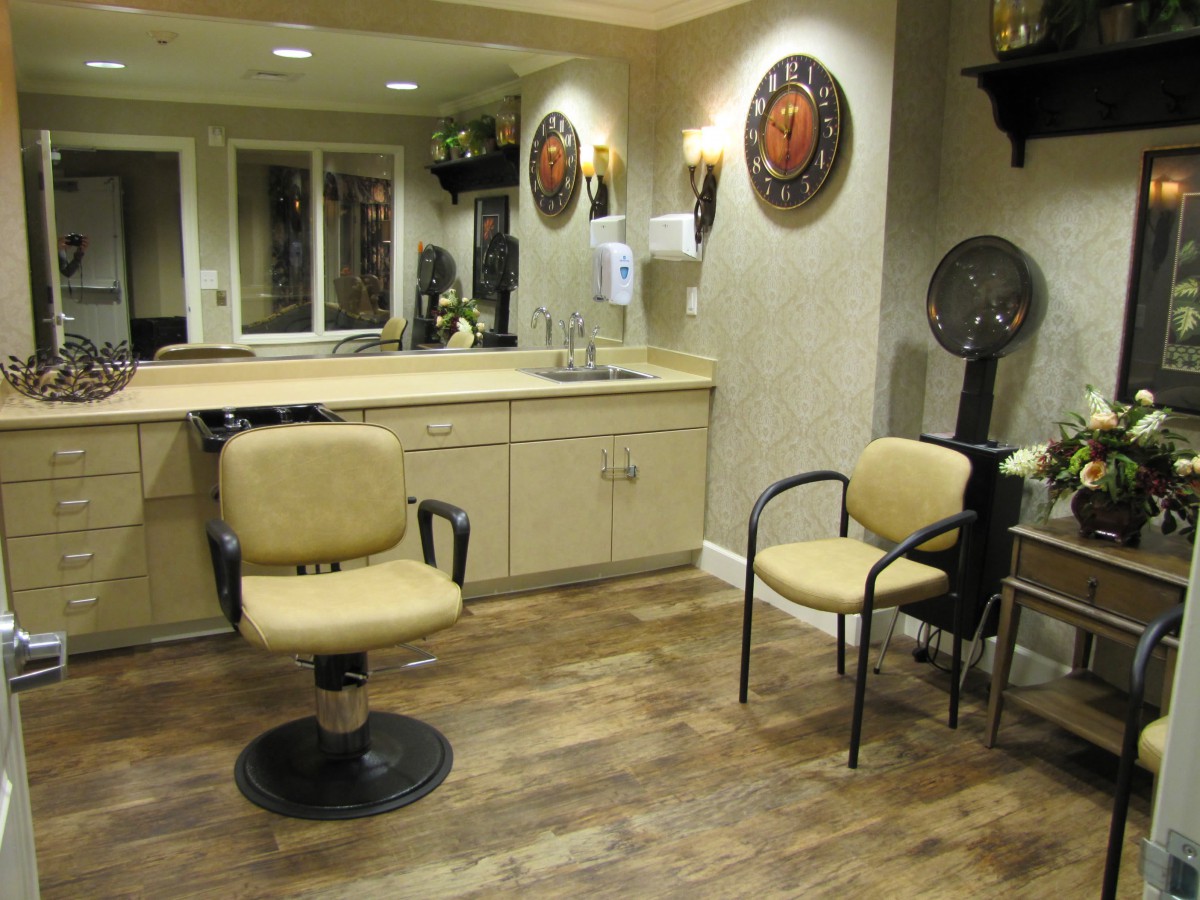 A cozy hair salon interior with styling chairs and mirrors.