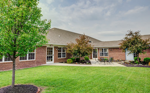 A well-maintained residential building featuring manicured lawns and thoughtful landscaping.