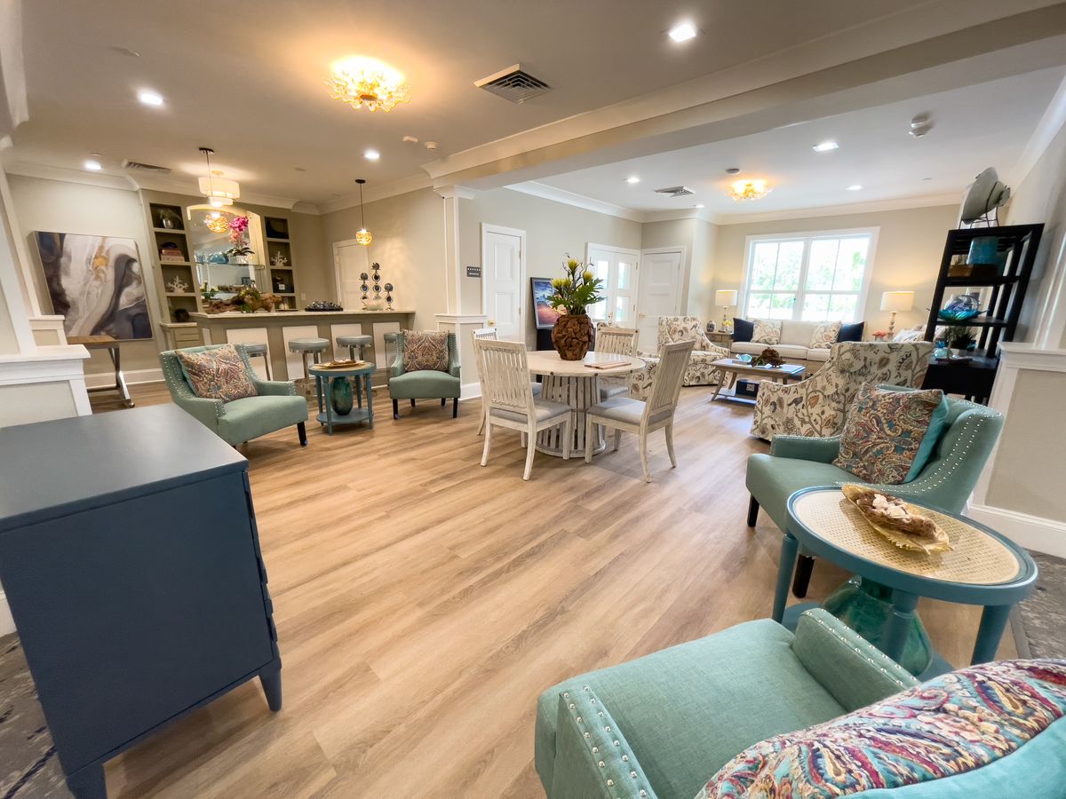A cozy and well-lit living room with modern decor and comfortable seating.