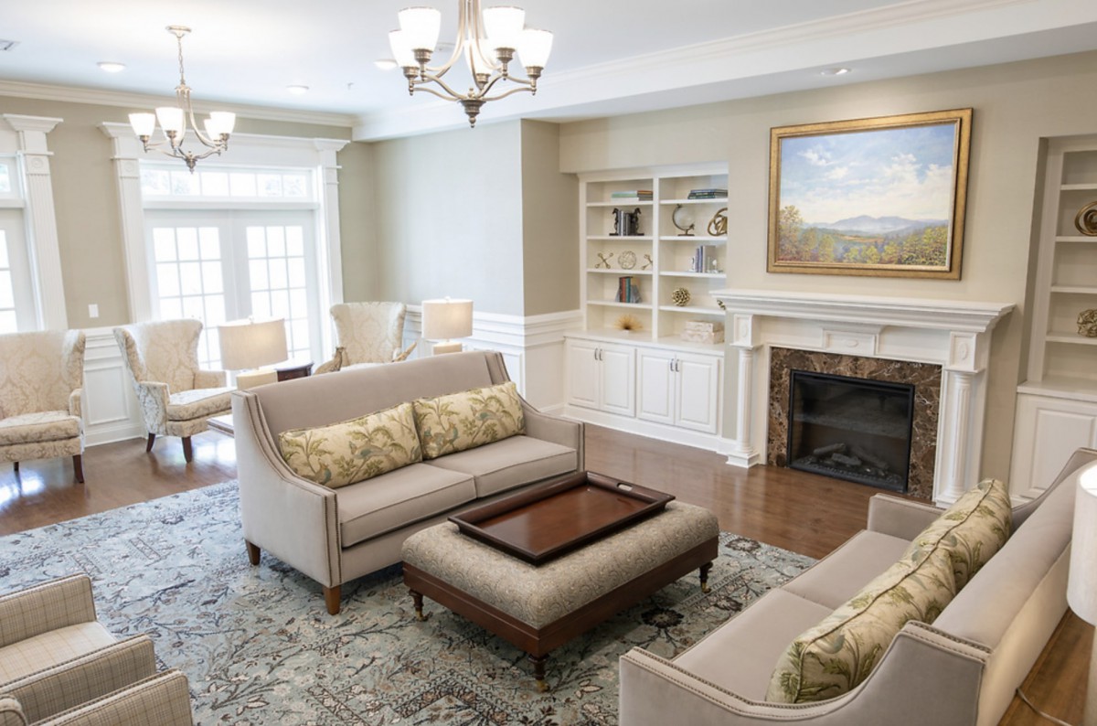 A beautifully designed living room featuring elegant furniture and a cozy fireplace.