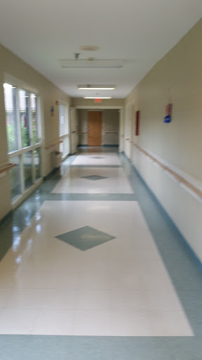 A clean and well-lit hallway in a medical facility.
