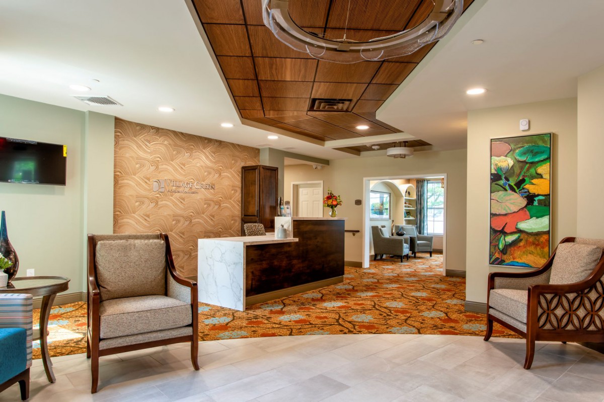 A modern and stylish reception area with cozy seating and elegant lighting.
