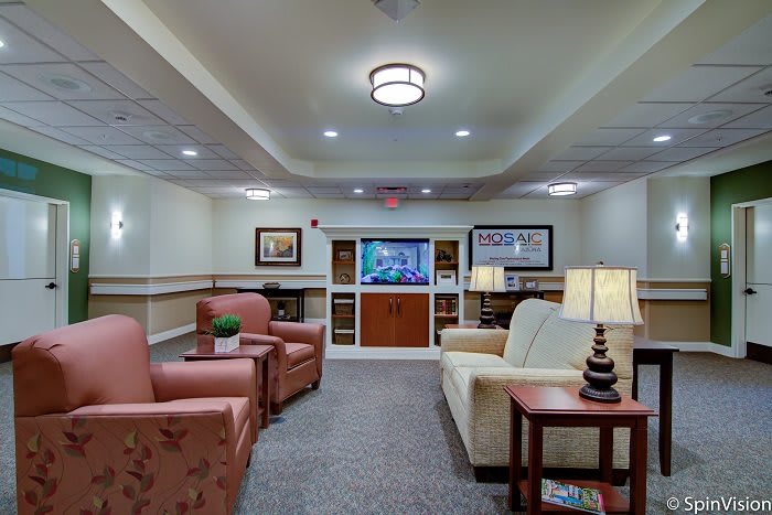 A cozy living room with comfortable seating and a television.