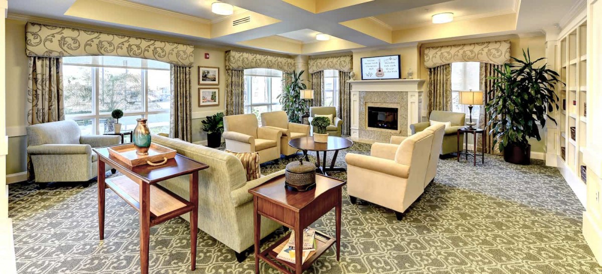 A cozy living room with elegant furniture and a fireplace.