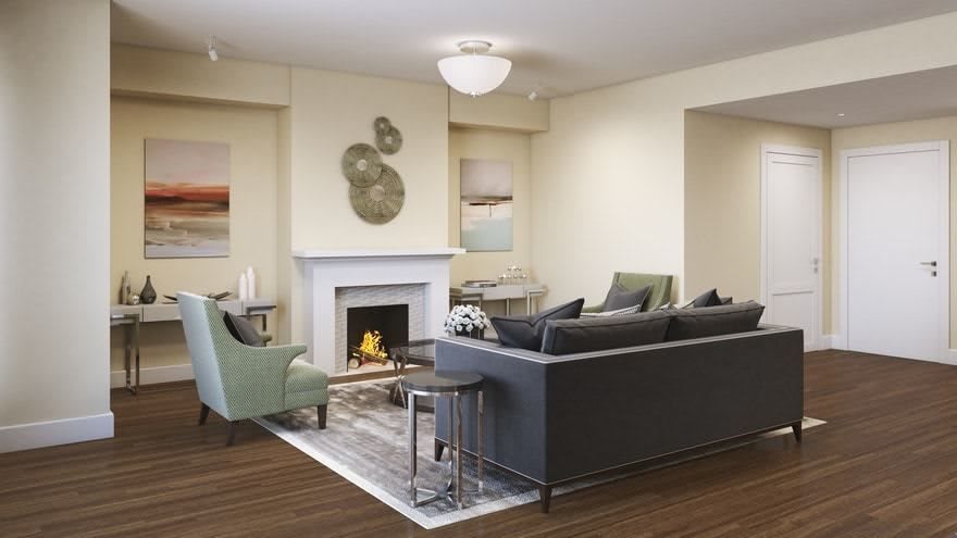 A modern living room featuring a cozy fireplace and stylish seating arrangement.