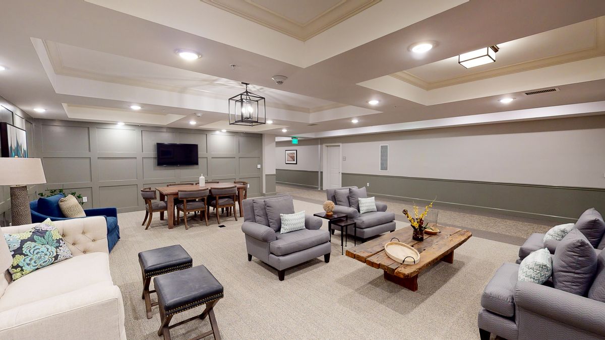 A modern living room with comfortable seating and stylish decor.